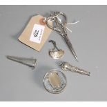 A silver and glass stamp moistener, a pair of silver handled scissors, in silver sheath, a silver