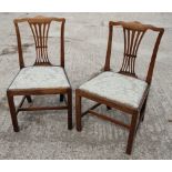 A pair of late Georgian "country Chippendale" style faded mahogany side chairs with wave top rails
