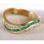 An 18ct gold ring set emeralds and diamonds, size P