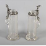 Two 19th Century engraved glass continental flagons with pewter lids, 10" high