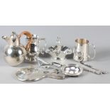 A collection of silver and silver plate, including silver framed cameos, silver hand-mirror, etc