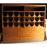 An oak shop storage unit fitted nine drawers and 24 sliding trays (ex Jackson's Corner Shop Reading)