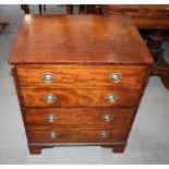 A 19th Century mahogany commode, disguised as a chest with dummy drawer fronts, and a Georgian style
