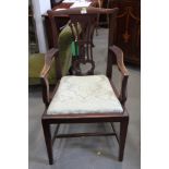 A "country Chippendale" style mahogany carver chair with drop-in seat, upholstered in a green