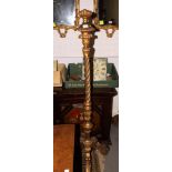 A giltwood standard lamp, on tripod base, light fitting removed