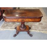 An early 19th Century crossbanded mahogany fold-over top card table with brass inlaid frieze, on