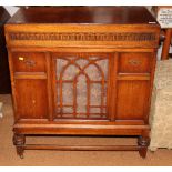 An Alba mid 20th Century gramophone, in an oak floor standing cabinet, together with three boxes