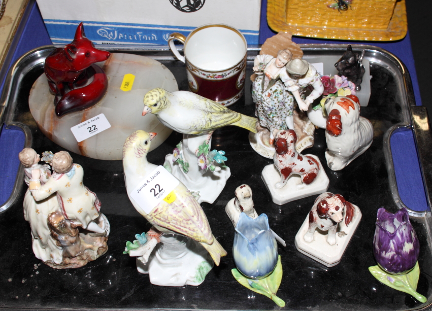 A collection of 19th Century birds and figures, three Staffordshire spaniels, a fox ashtray, an onyx