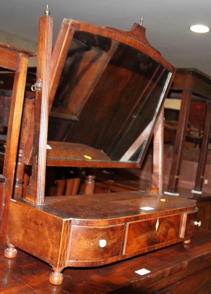 A Georgian inlaid mahogany and crossbanded shaped toilet mirror, fitted three drawers, 22 1/2" wide