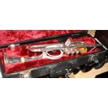A Yamaha silver plated trumpet, in carrying case, and four instruction books