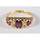 An Edwardian 18ct gold, ruby and diamond dress ring, size L