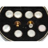 An 18ct gold dress stud, an 18ct gold dress stud with mother-of-pearl and seed pearl mount, 2.2g