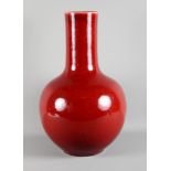 A 19th Century Chinese porcelain bulbous vase decorated sang de boeuf glaze, 19 1/2" high