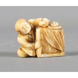 A Japanese carved ivory netsuke and a carved ivory