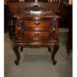 A cherry wood two-drawer bedside chest, fitted glass top, 20" wide