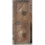 A 17th Century style oak door decorated two lozenge-shaped fielded panels, 77" x 29" and another