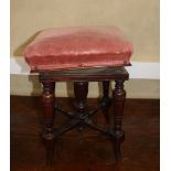 A Victorian square mahogany piano stool with adjustable seat, upholstered in a pink velvet