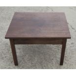 A circular polished as mahogany occasional table, on three turned supports and triangular base,