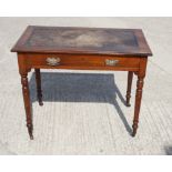 A late Victorian writing table with inlet leather top and frieze drawer, on turned supports, 36"