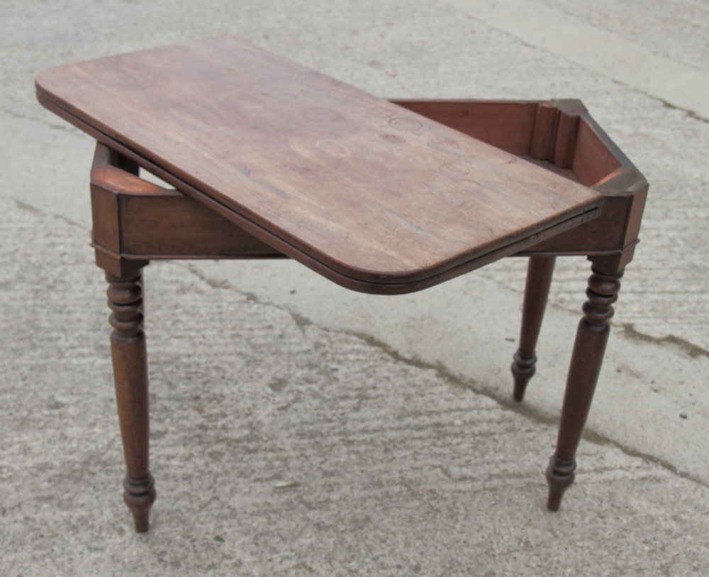 A 19th Century mahogany fold-over tea table, on turned supports, 36" wide - Image 3 of 4