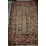 A Persian rug decorated Herati pattern on a central ground, 80" x 71" approx (worn)