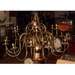 A Cromwellian design eighteen-branch brass pendant centre light with scroll arms, 51" dia