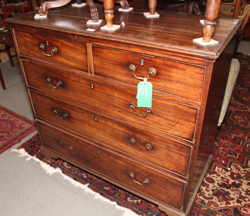 A 19th Century mahogany chest of three long and two short drawers, on bracket supports, 42 1/2"