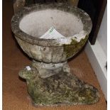 A weathered stone garden ornament of a seal and a shallow stone garden urn, 22" dia