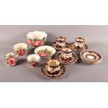 Five Wemyss pieces and a number of Staffordshire coffee cups and saucers decorated in navy and