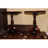 A pair of Georgian design mahogany circular occasional tables, on tripod bases, 19" dia
