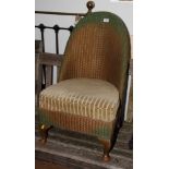 A Lusty Lloyd Loom green and gilt decorated nursing chair with sprung seat cushion