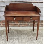 A 19th Century mahogany washstand with polished top, three-quarter gallery, two frieze drawers, on