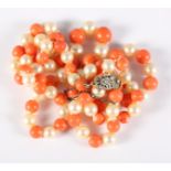 A coral and pearl necklace with gold and diamond clasp