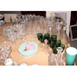 A collection of glass, including claret jug, etched finger bowls, green wine glasses, decanters,