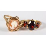 A 9ct gold and garnet three-stone dress ring and a 9ct gold cameo dress ring