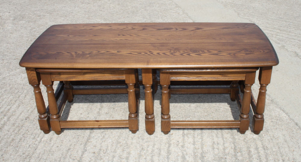 An Ercol 17th Century style nest of three elm coffee tables - Image 2 of 2