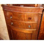 A Georgian style mahogany bowfront cupboard, fitted two drawers, 24" wide