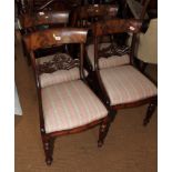 A set of six late Regency mahogany standard chairs with plain shoulder boards, carved and pierced