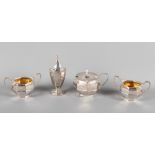 An octagonal silver three-piece cruet set and a matching silver pepper pot, 6.7oz troy approx