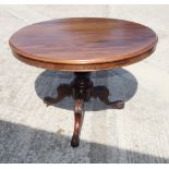 A 19th Century circular mahogany tilt top dining table, on leaf carved tripod base, 40" dia