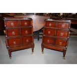 A pair of early 19th Century style mahogany bedside chests, fitted three stepped front drawers, on