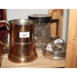 An old Sheffield plate tankard, a silver plated mounted glass biscuit box, a plated wine coaster and