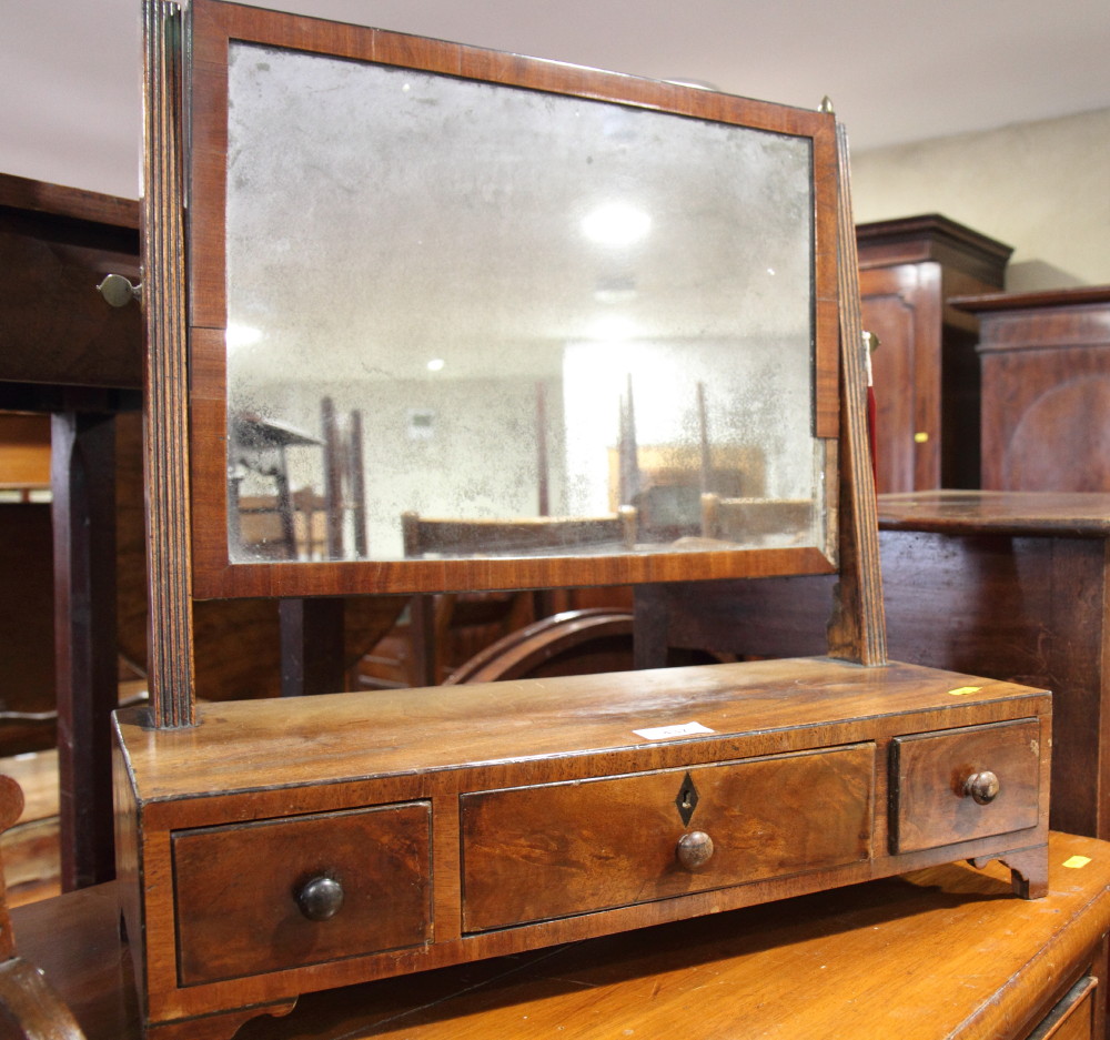 A 19th Century toilet mirror, fitted three drawers, on bracket supports, 20" wide