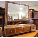 A 19th Century toilet mirror, fitted three drawers, on bracket supports, 20" wide