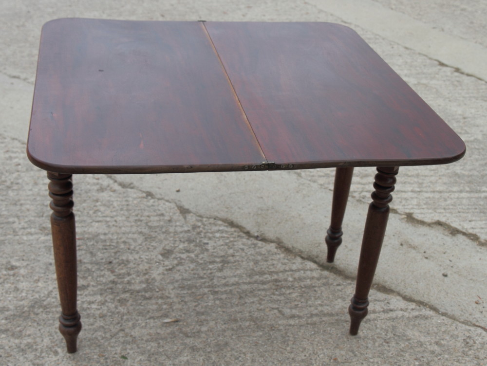 A 19th Century mahogany fold-over tea table, on turned supports, 36" wide - Image 2 of 4