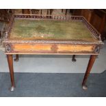 A Georgian design mahogany writing table with leather inlet top, spindle turned three quarter