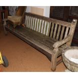 A slatted teak garden bench, 96" long