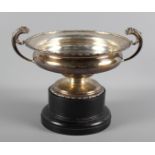 A two-handled pedestal silver bowl, on an ebony stand, 16.9oz troy approx