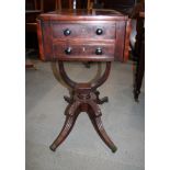 An early Victorian mahogany drop leaf work table, fitted real and dummy end drawers, on four splayed