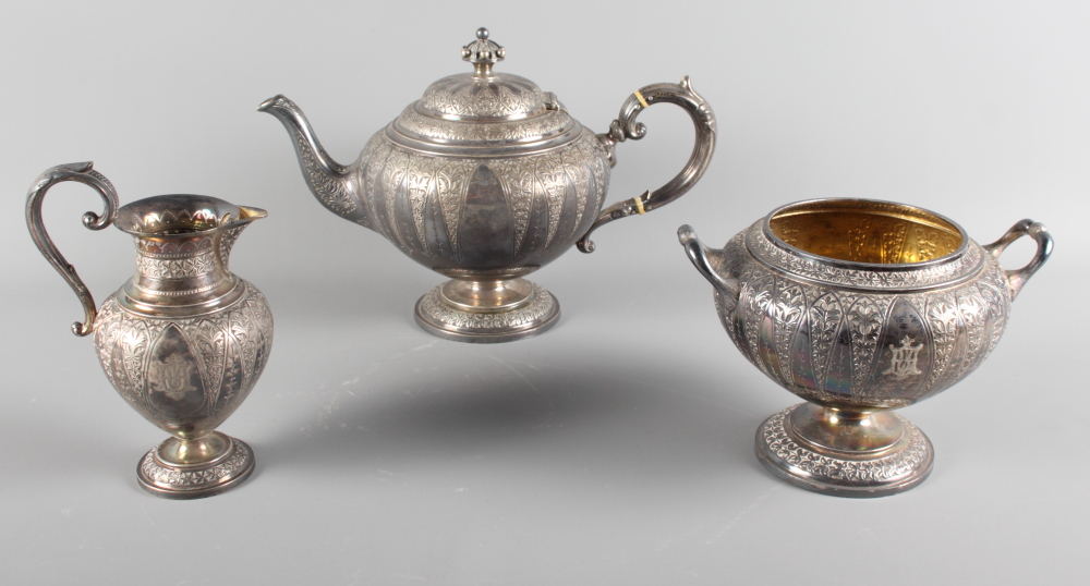 A Victorian Scottish silver three-piece teaset with embossed decoration, 41.2oz troy approx